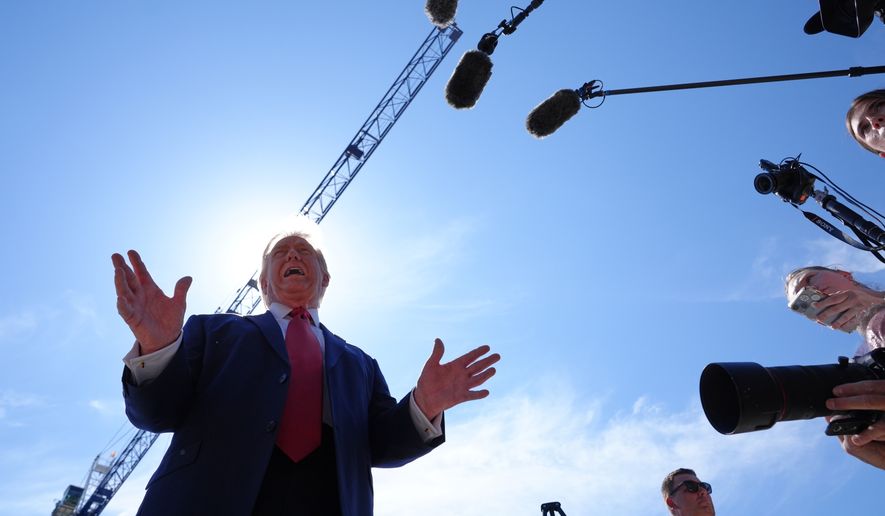President Donald Trump tours Ballroom construction around the outside the White House, Tuesday, May 19, 2026, in Washington. (AP Photo/Jacquelyn Martin)