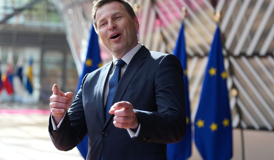 Estonia's Defense Minister Hanno Pevkur speaks with the media as he arrives for a meeting of EU defense ministers at the European Council building in Brussels, Tuesday, May 12, 2026. (AP Photo/Virginia Mayo)