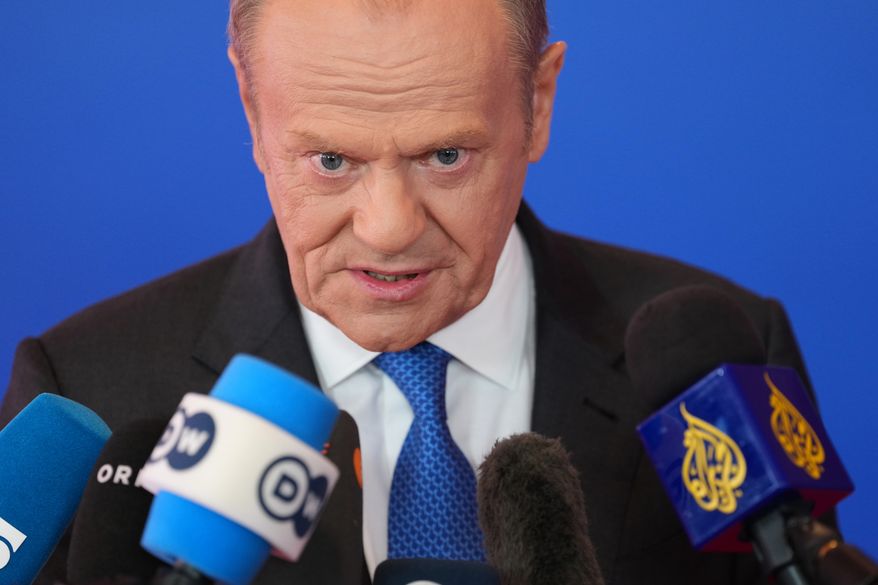 Poland's Prime Minister Donald Tusk speaks with the media as he arrives for the EU Summit in Nicosia, Cyprus, Friday, April 24, 2026. (AP Photo/Petros Karadjias)