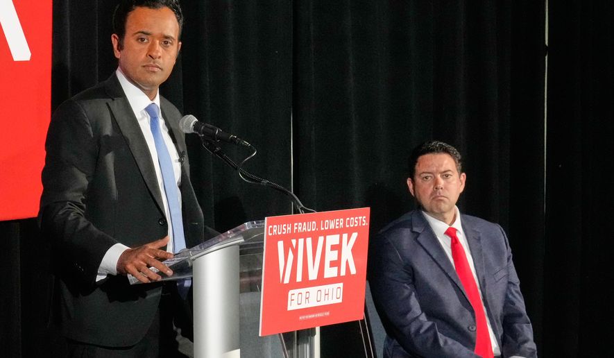 Vivek Ramaswamy, left, candidate for Governor in Ohio, and his running mate, Ohio Senate President Rob McColley, right, listen to a question during a news conference on Medicaid fraud in Columbus, Ohio, Tuesday, May 19, 2026. (AP Photo/Sue Ogrocki)