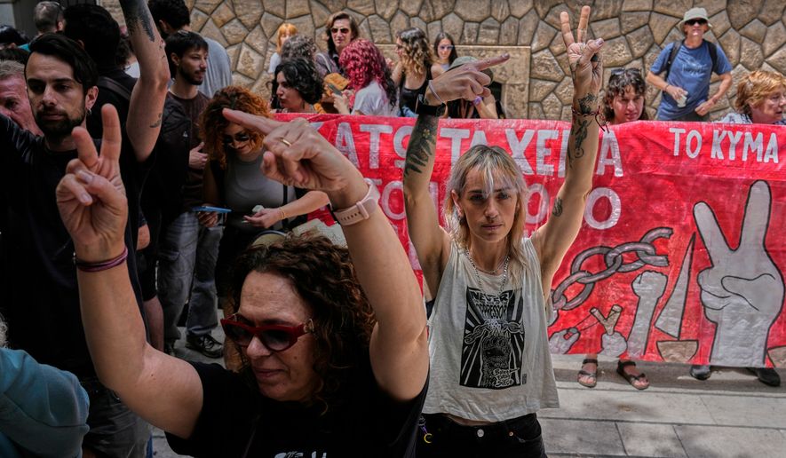 Protesters chant pro-Palestinian slogans outside Greece's Foreign Ministry after Israel's navy intercepted an activist flotilla in waters off of Cyprus, in Athens, Tuesday, May 19, 2026. (AP Photo/Thanassis Stavrakis)