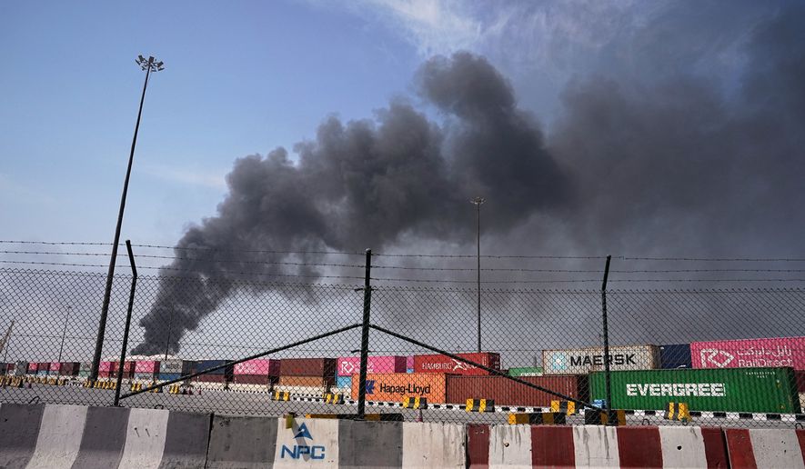 Smoke rises after an Iranian drone attack in the port area of Dubai, United Arab Emirates, March 1, 2026. (AP Photo/Fatima Shbair) **FILE**
