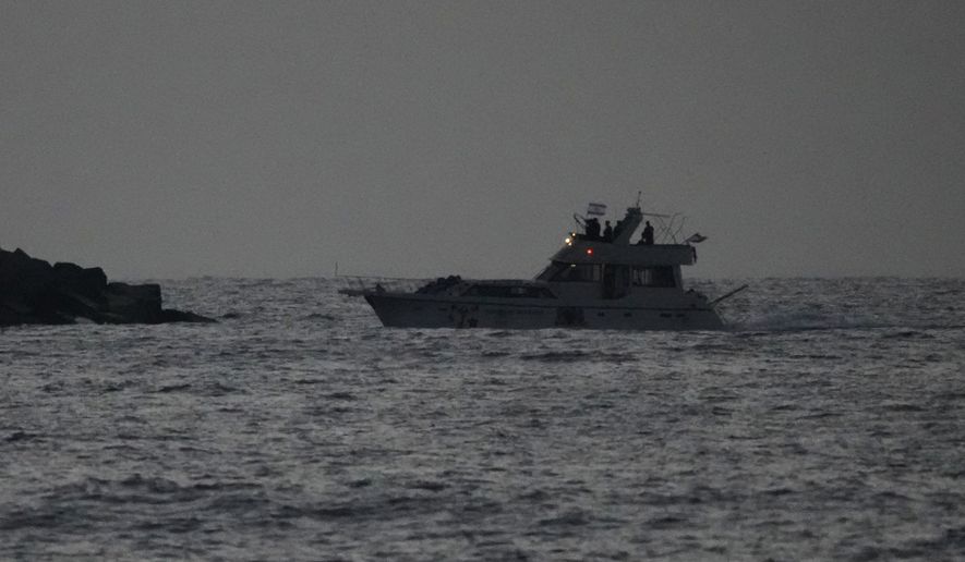 Israeli naval forces sail a confiscated Gaza-bound flotilla boat into Israel's Ashdod port after intercepting the vessel on the Mediterranean Sea, Tuesday, May 19, 2026. (AP Photo/Ariel Schalit)