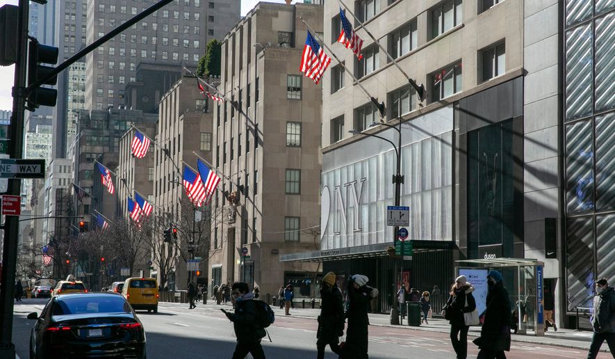 American flags wave in the wind on Fifth Avenue in the borough of Manhattan in New York City on Friday, Jan. 21, 2022. (AP Photo/Ted Shaffrey, file)