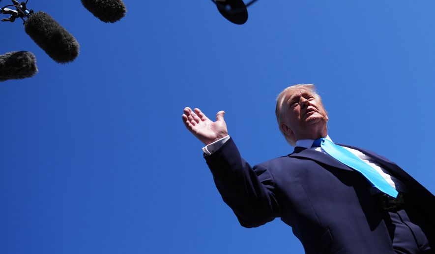 President Donald Trump speaks to the press before boarding Air Force One, Wednesday, May 20, 2026, at Joint Base Andrews, Md., en route to speak at the U.S. Coast Guard Academy commencement. (AP Photo/Jacquelyn Martin)