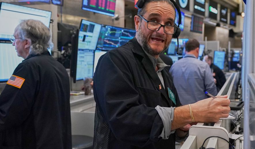 Options trader Chris Dattolo works on the floor of the New York Stock Exchange, Wednesday, May 13, 2026. (AP Photo/Richard Drew)