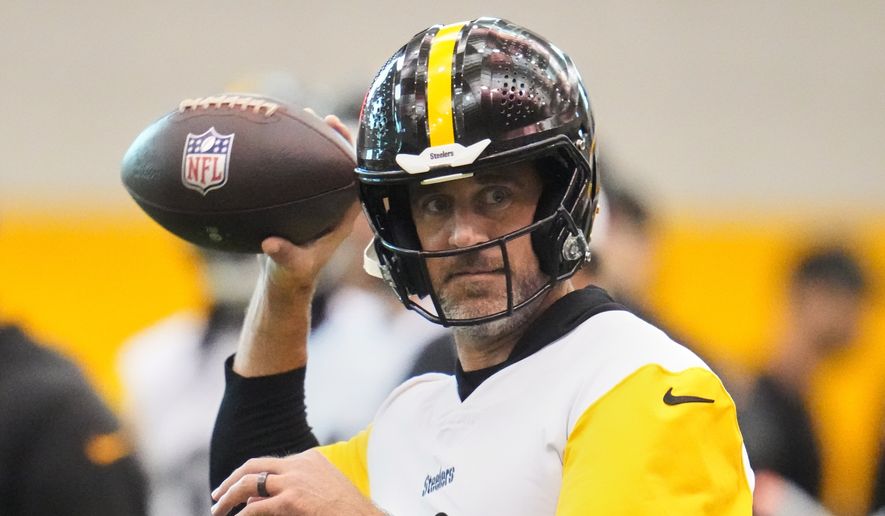Pittsburgh Steelers quarterback Aaron Rodgers (8) throws during NFL football practice in Pittsburgh, Wednesday, May 20, 2026. (AP Photo/Gene J. Puskar)