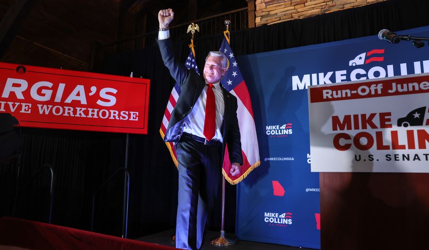 U.S. Rep. Mike Collins, R-Ga., walks out to speak at his primary election watch party in Jackson, Ga. on Tuesday, May 19, 2026. (Arvin Temkar/Atlanta Journal-Constitution via AP)