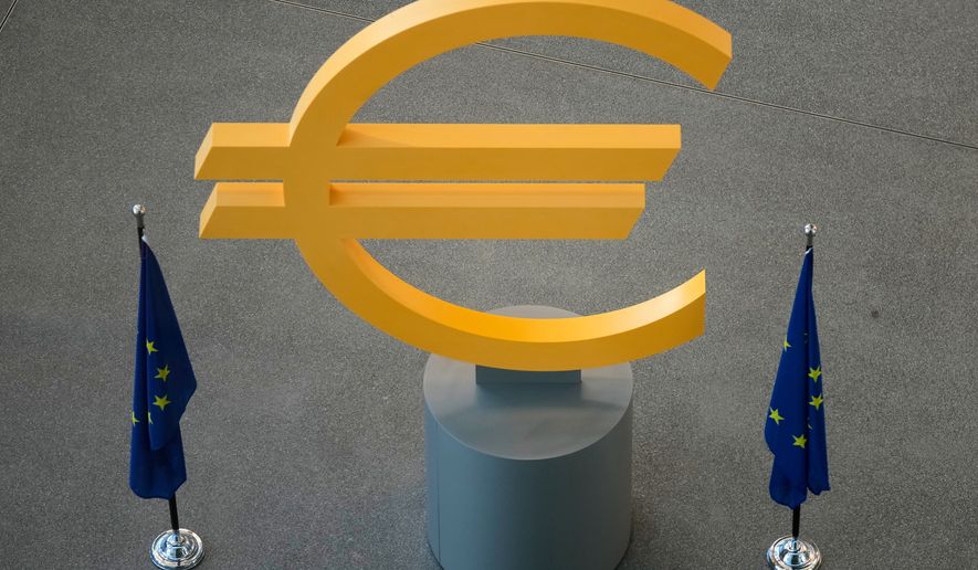 FILE -The Euro currency symbol is seen prior to a press conference after an ECB's governing council meeting in Frankfurt, Germany, Dec. 18, 2025. (AP Photo/Michael Probst, File)