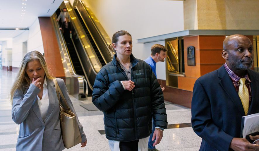 Aimee Bock, founder and executive director of the nonprofit organization Feeding Our Future, arrives at the Minneapolis federal courthouse with her attorney, Ken Udoibok, right, on March 19, 2025, in Minneapolis. (Kerem Yücel/Minnesota Public Radio via AP) **FILE**