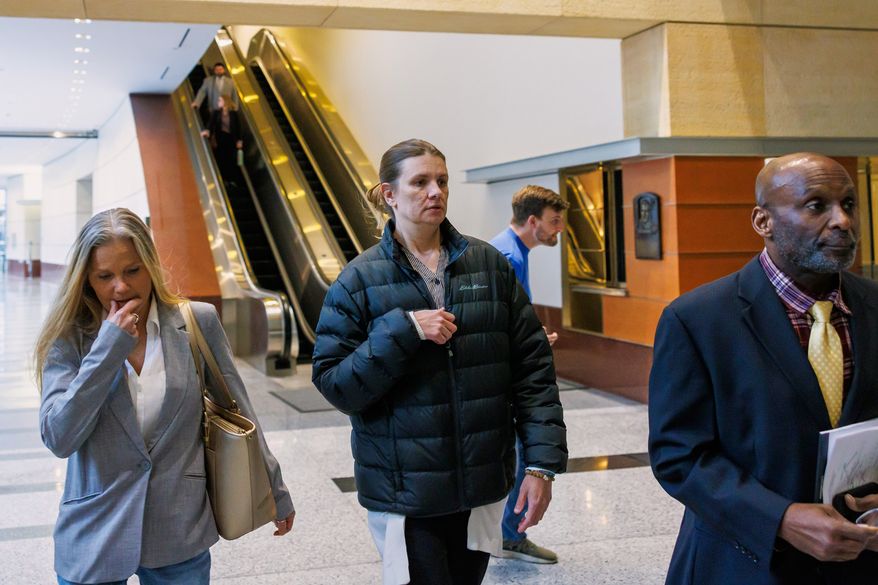 Aimee Bock, founder and executive director of the nonprofit organization Feeding Our Future, arrives at the Minneapolis federal courthouse with her attorney, Ken Udoibok, right, on March 19, 2025, in Minneapolis. (Kerem Yücel/Minnesota Public Radio via AP) **FILE**