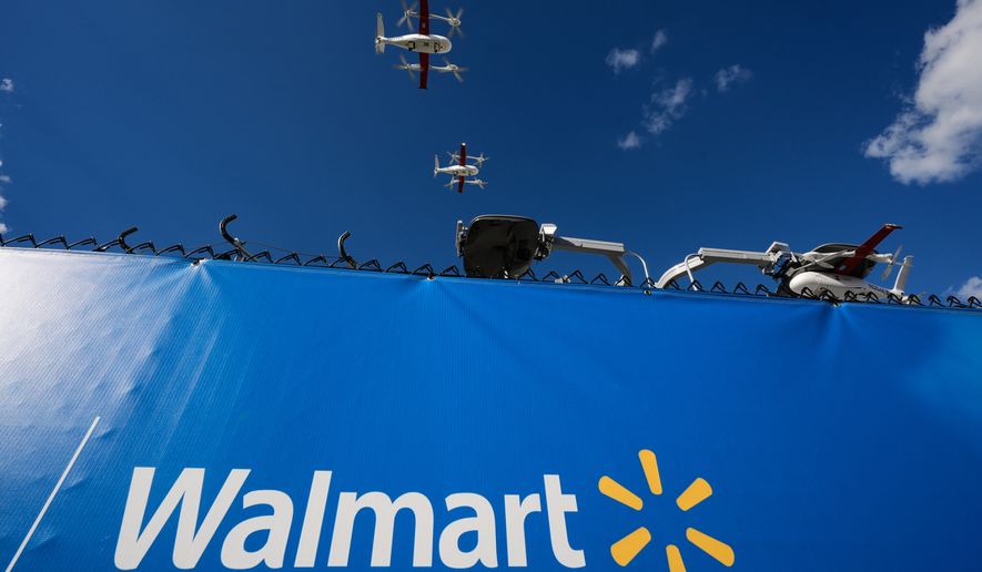 Drones operated by Zipline leave base to make deliveries from a Walmart store in Pea Ridge, Ark., Friday, Sept. 26, 2025. (AP Photo/Charlie Riedel)