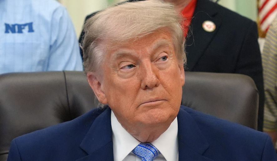 President Donald Trump attends an event about loosening a federal refrigerant rule, in the Oval Office at the White House, Thursday, May 21, 2026, in Washington. (AP Photo/Jacquelyn Martin)