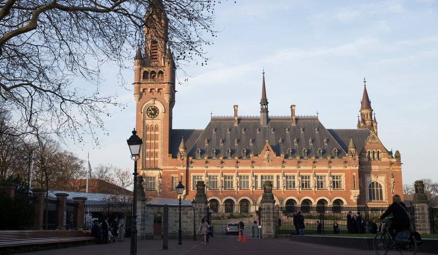 FILE - Exterior view of the Peace Palace, which houses the International Court of Justice, or World Court, in The Hague, Netherlands, Monday, Feb. 18, 2019. (AP Photo/Peter Dejong, File)