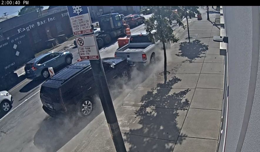 Still from the DOJ-released video shows an SUV smashing a federal ICE law enforcement pickup truck on a Chicago street during a vehicle ramming attack. (Courtesy of the Department of Justice)
