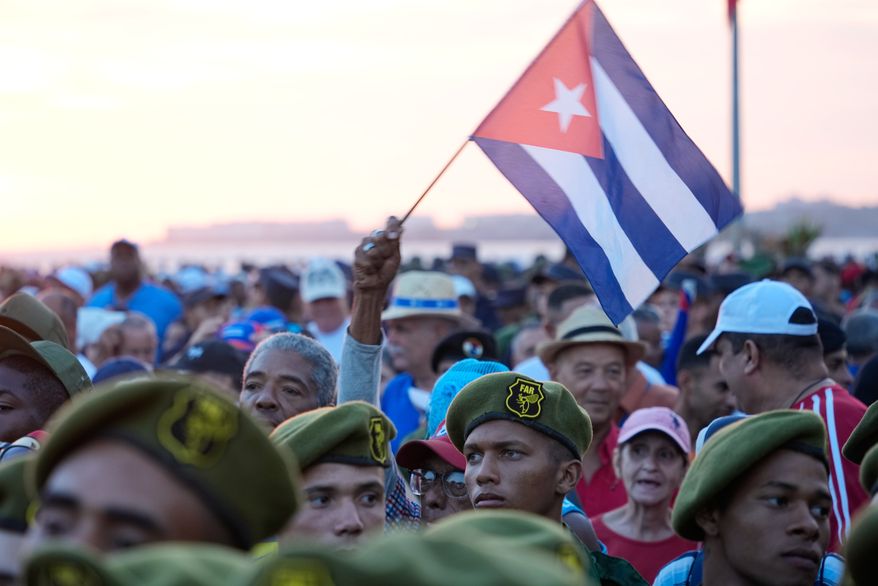 Members of the Revolutionary Armed Forces attend a rally in support of former President Raul Castro in front of the U.S. Embassy in Havana, Cuba, Friday, May 22, 2026, after U.S. prosecutors filed an indictment accusing him of ordering the 1996 shootdown of civilian planes flown by Miami-based exiles. (AP Photo/Ramon Espinosa)