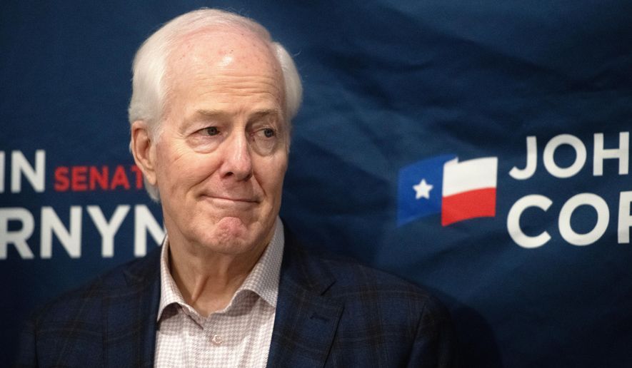 Sen. John Cornyn, R-Texas, listens to State Sen. Charles Perry, R-Lubbock, during a campaign event in Lubbock, Texas, Tuesday, May 19, 2026. (AP Photo/Annie Rice)