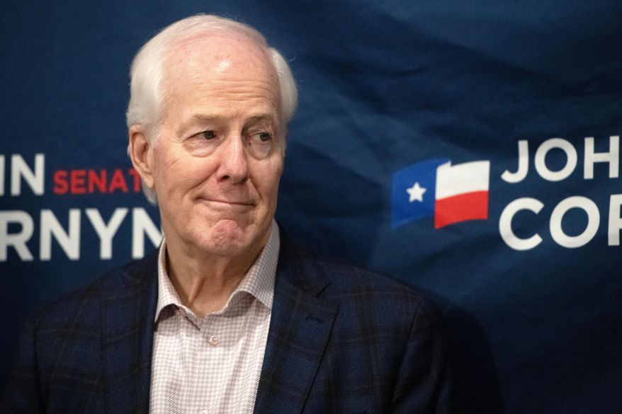 Sen. John Cornyn, R-Texas, listens to State Sen. Charles Perry, R-Lubbock, during a campaign event in Lubbock, Texas, Tuesday, May 19, 2026. (AP Photo/Annie Rice)