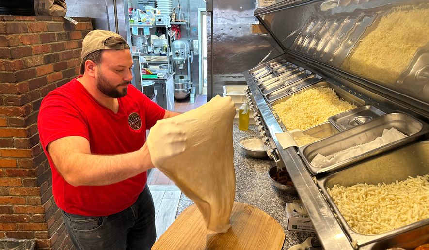 Salvatore Lo Duca makes pizza at Lo Duca Pizza Tuesday, May 12, 2026, in the Brooklyn borough of New York. (AP Photo/David R. Martin)