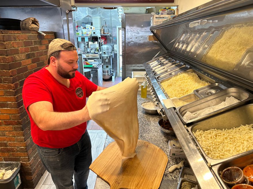 Salvatore Lo Duca makes pizza at Lo Duca Pizza Tuesday, May 12, 2026, in the Brooklyn borough of New York. (AP Photo/David R. Martin)