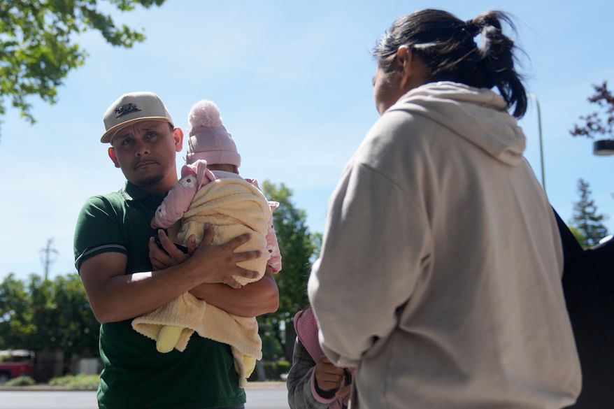 Oliverio Mora Huerta, left, is interviewed with his family before going to Immigration Court Tuesday, May 12, 2026, in Concord, Calif. (AP Photo/Jeff Chiu)