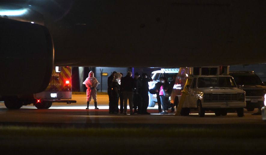American passengers from the cruise ship, MV Hondius that was stricken with hantavirus, arrived in Omaha, Nebraska after flying from Tenerife, Spain on Monday, May 11, 2026. (AP Photo/Nick Ingram)