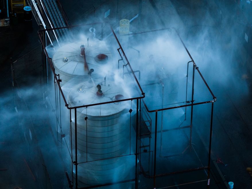 Water is sprayed on a tank that overheated at an aerospace plant in Garden Grove, Calif., Friday, May 22, 2026. (AP Photo/Ethan Swope)