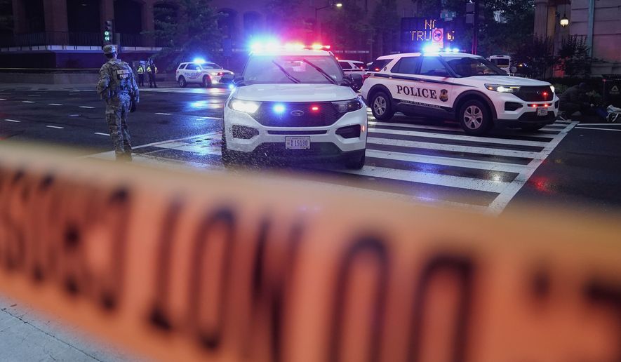 U.S. Secret Service Police are seen on a crime scene after responding to reports of shots fired near the White House, Saturday, May 23, 2026, in Washington. (AP Photo/Jose Luis Magana)