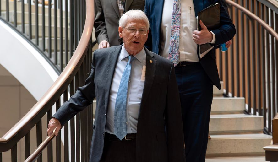 Sen. Roger Wicker, R-Miss., chairman of the Senate Armed Services Committee, walks to a closed-door briefing on the Iran war at the Capitol, March 10, 2026, in Washington. (AP Photo/Jose Luis Magana, File)