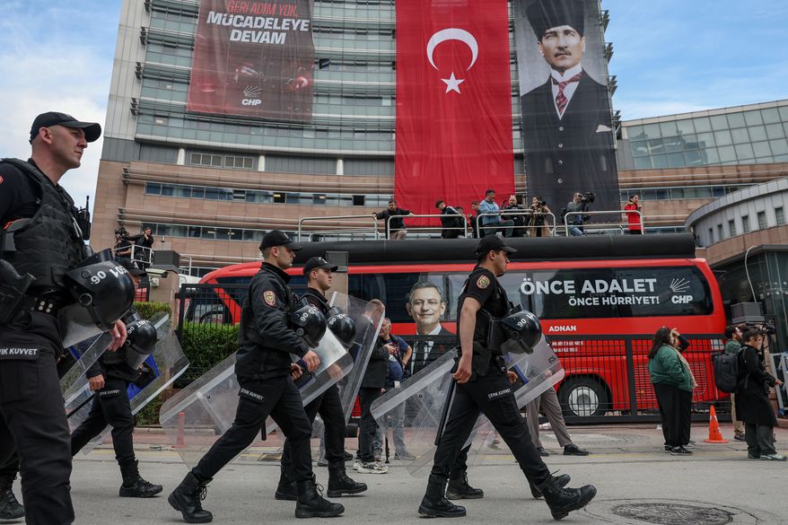Police officers arrive at Turkey's main opposition Republican People's Party (CHP) headquarters in Ankara, Sunday, May 24, 2026, to evict supporters gathered inside. (Ugur Yildirim/DIA Photo via AP)