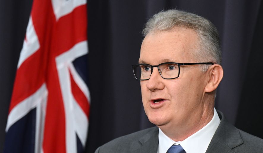 Australian Home Affairs Minister Tony Burke speaks to the media during a press conference at Parliament House in Canberra, Australia, Wednesday, March 11, 2026. (Lukas Coch/AAPImage via AP, File)