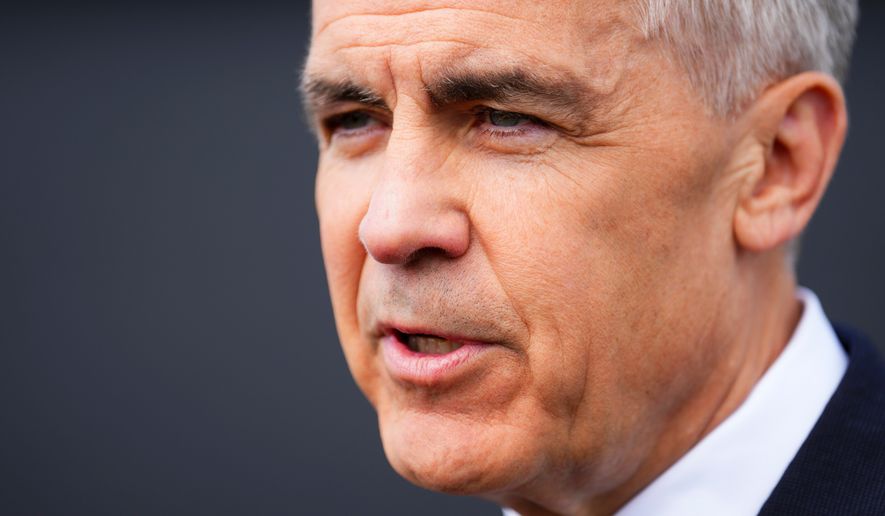 Prime Minister Mark Carney talks to reporters as he takes part in an event at a new housing development in Orleans, Ont., on Monday, May 25, 2026. (Sean Kilpatrick /The Canadian Press via AP)