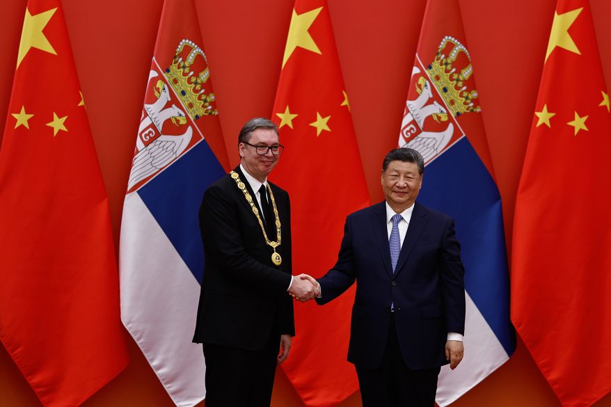 Chinese President Xi Jinping shakes hands with Serbian President Aleksandar Vucic after he received the Friendship Medal of the People's Republic of China, at the Great Hall of the People, in Beijing, China Monday, May 25, 2026. (Tingshu Wang, Pool Photo via AP)