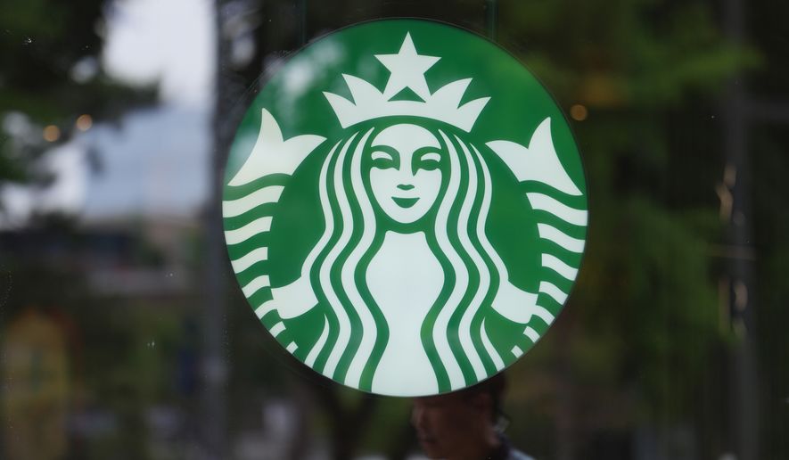 A sign for Starbucks is displayed in Seoul, South Korea, Tuesday, May 26, 2026. (AP Photo/Lee Jin-man)