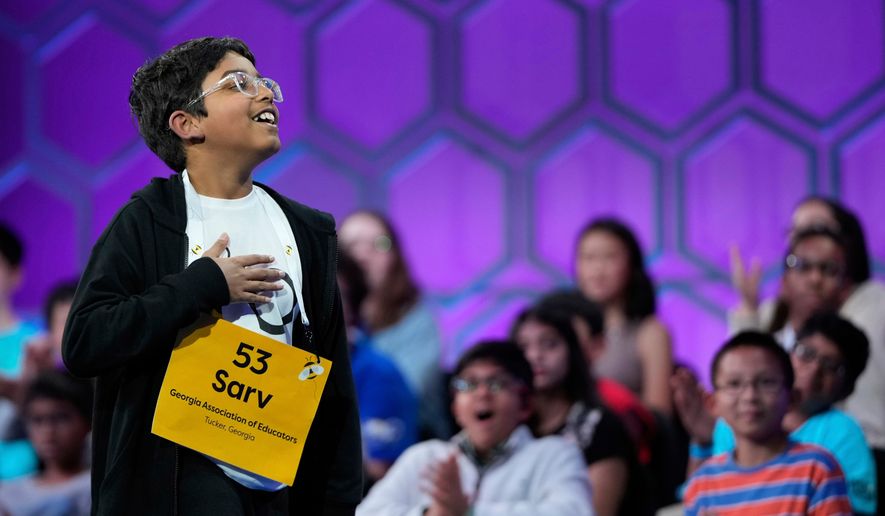 Sarv Dharavane, 11, of Tucker, Ga., reacts after spelling his word correctly in the finals of the Scripps National Spelling Bee, Thursday, May 29, 2025, in Oxon Hill, Md. (AP Photo/Julia Demaree Nikhinson, File)