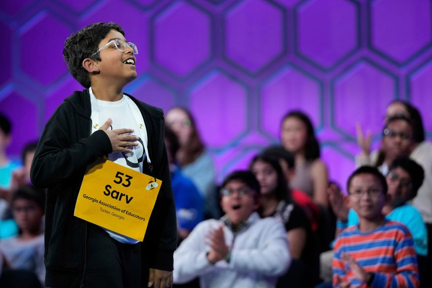 Sarv Dharavane, 11, of Tucker, Ga., reacts after spelling his word correctly in the finals of the Scripps National Spelling Bee, Thursday, May 29, 2025, in Oxon Hill, Md. (AP Photo/Julia Demaree Nikhinson, File)
