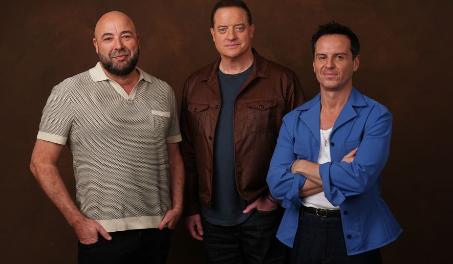 Anthony Maras, left, director/co-writer of the film "Pressure," poses with cast members Brendan Fraser, center, and Andrew Scott on Tuesday, May 12, 2026, in Los Angeles. (AP Photo/Chris Pizzello)
