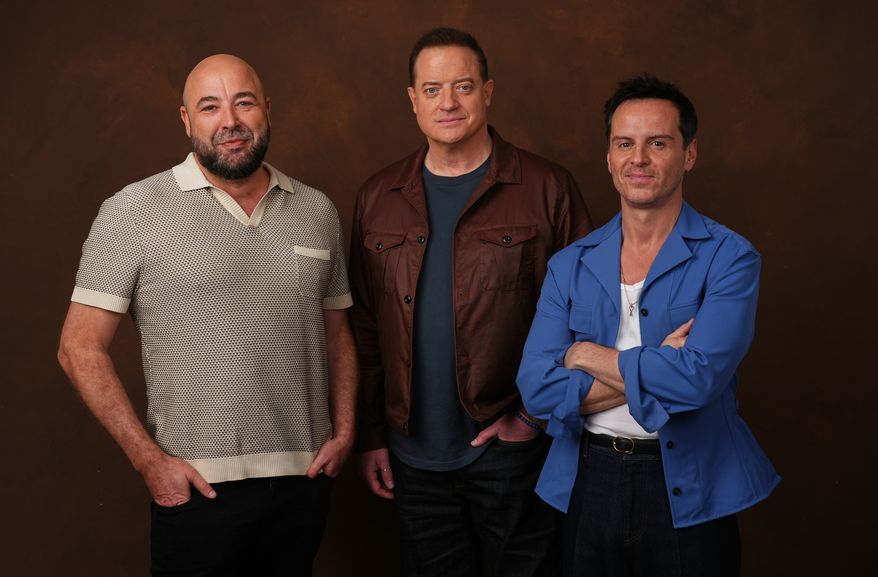 Anthony Maras, left, director/co-writer of the film "Pressure," poses with cast members Brendan Fraser, center, and Andrew Scott on Tuesday, May 12, 2026, in Los Angeles. (AP Photo/Chris Pizzello)