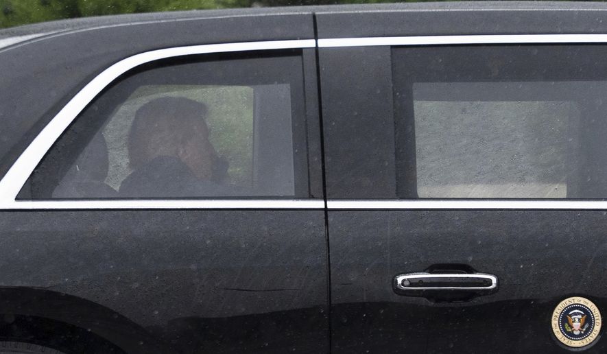 President Donald Trump sits at the back of the presidential limousine as it drives outside the Walter Reed National Military Medical Center from the White House, Tuesday, May 26, 2026, in Bethesda, Md. (AP Photo/Manuel Balce Ceneta)