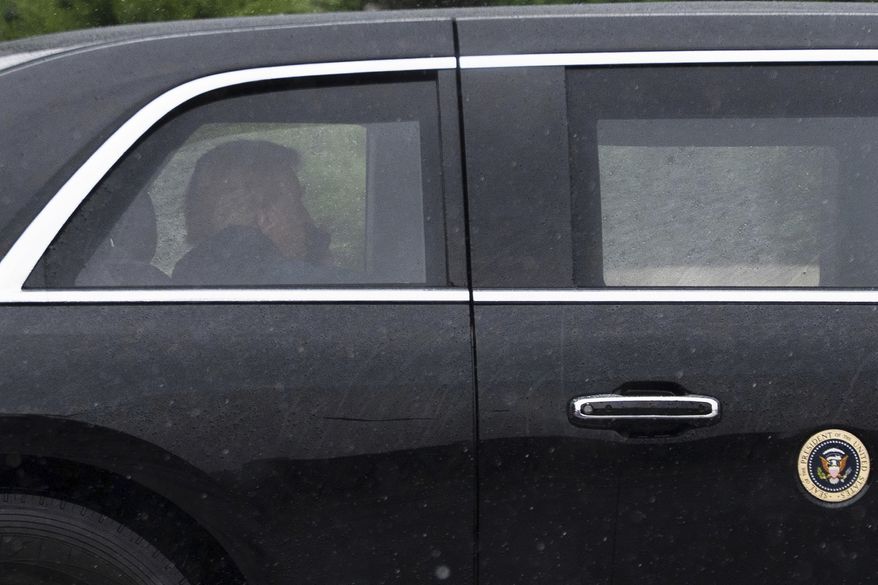 President Donald Trump sits at the back of the presidential limousine as it drives outside the Walter Reed National Military Medical Center from the White House, Tuesday, May 26, 2026, in Bethesda, Md. (AP Photo/Manuel Balce Ceneta)