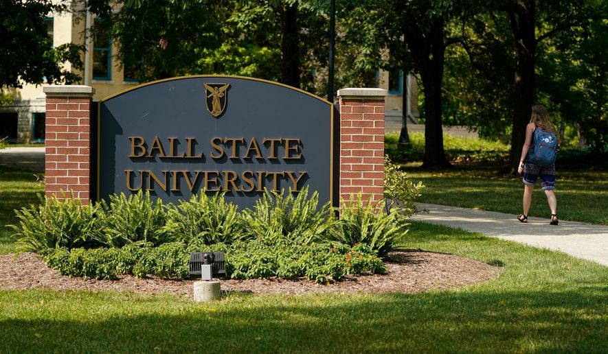 A student enters Ball State University campus in Muncie, Ind., Sept. 10, 2020. (AP Photo/Michael Conroy, File)