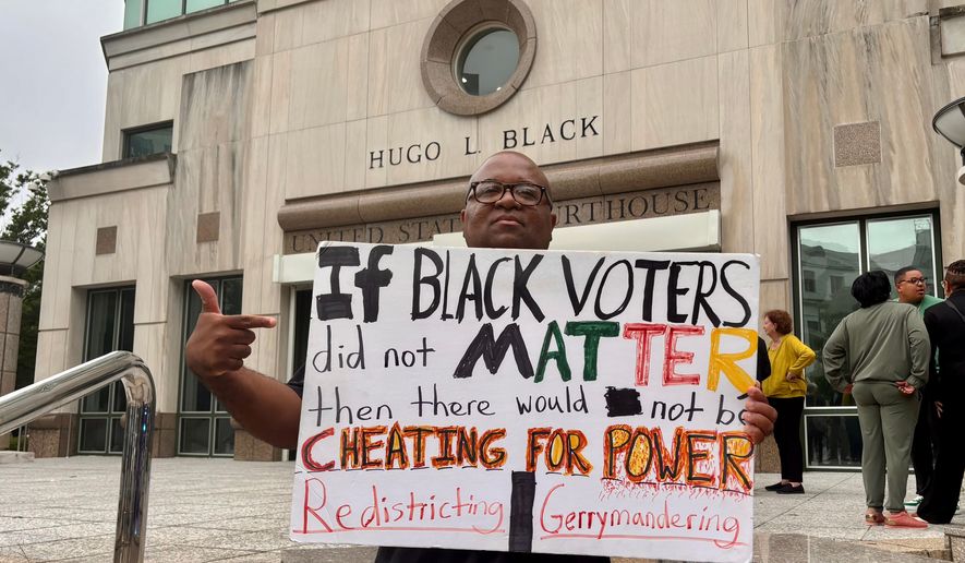 Travis Jackson stands outside the federal courthouse on Friday, May 22, 2026, in Birmingham, Ala. after a court hearing related to redistricting litigation. (AP Photo/Kim Chandler)