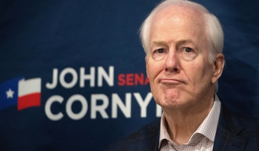 Sen. John Cornyn, R-Texas, listens to State Sen. Charles Perry, R-Lubbock, during a campaign event in Lubbock, Texas, Tuesday, May 19, 2026. (AP Photo/Annie Rice)