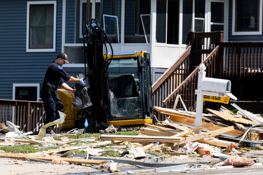 First responders work at the scene of an explosion at a home in Comstock Park, Mich. on Tuesday, May 26, 2026. (Joel Bissell/Kalamazoo Gazette via AP)