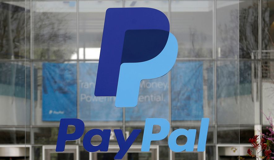 FILE - The PayPal logo hangs displayed outside their company headquarters on March 10, 2015, in San Jose, Calif. (AP Photo/Jeff Chiu, File)
