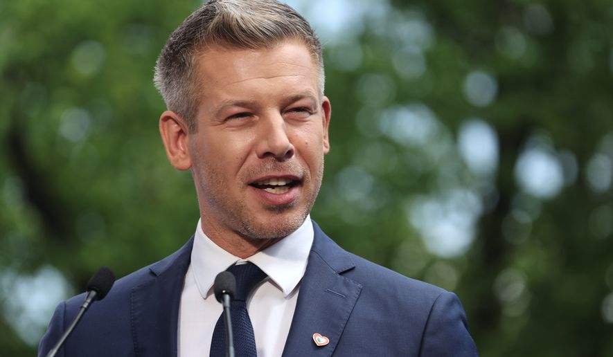 Hungarian Prime Minister Peter Magyar speaks during a joint press conference with Poland's Prime Minister Donald Tusk in Warsaw, Poland, Wednesday, May 20, 2026. (AP Photo/Beata Zawrzel)