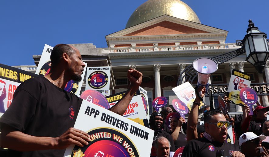 Members of the App Drivers Union hold a rally outside the Massachusetts State House after the announcement that it had become the first certified union of rideshare drivers in the nation, on Tuesday, May 26, 2026, in Boston. (AP Photo/Leah Willingham)