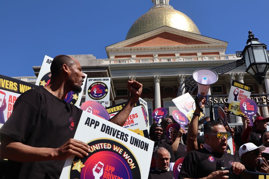 Members of the App Drivers Union hold a rally outside the Massachusetts State House after the announcement that it had become the first certified union of rideshare drivers in the nation, on Tuesday, May 26, 2026, in Boston. (AP Photo/Leah Willingham)