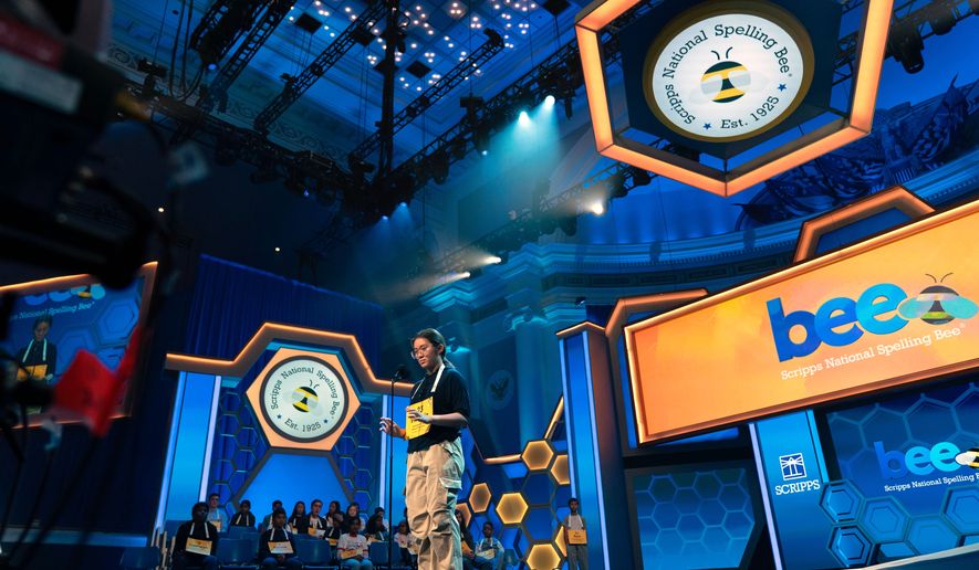 Victoria Li, 12, of Eastvale, Calif., spells his word during the preliminary round of the Scripps National Spelling Bee at DAR Constitution Hall, Tuesday, May 26, 2026, in Washington. (AP Photo/Jose Luis Magana)