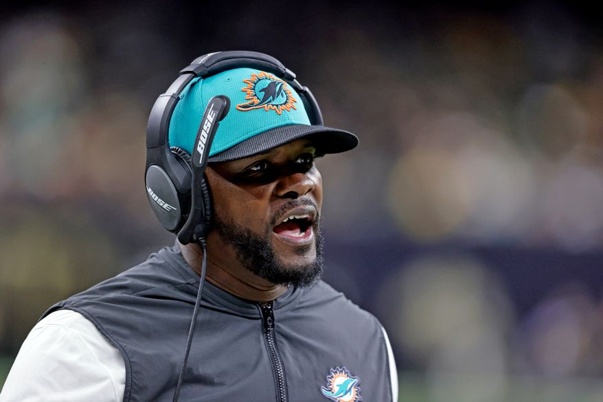 FILE - Miami Dolphins coach Brian Flores yells during the second half of an NFL football game against the New Orleans Saints Monday, Dec. 27, 2021, in New Orleans. (AP Photo/Butch Dill, File)